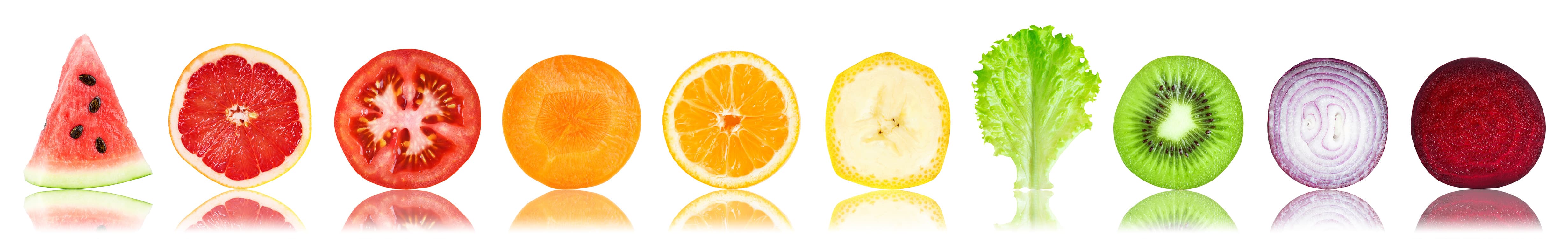 Collection of fresh fruit and vegetable slices on white background